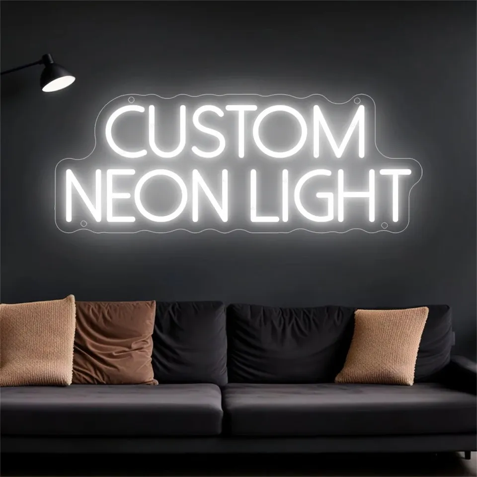 A custom neon light reading CUSTOM NEON LIGHT on a dark wall